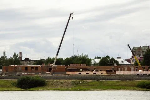 New construction of a residential complex on the riverside Stock Photos