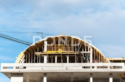 New curve roof residential building construction site with scaffolding Stock Photos