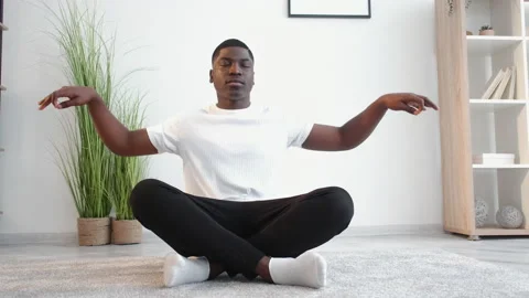 New day harmony calm black man home yoga practice Stock Footage 157498085