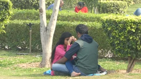 New Delhi - Public display of affection of romantic happy lovers at central park Stock Footage 197004442