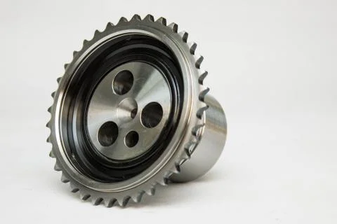New details on a gray background. The camshaft gears,crankshaft gear. Stock Photos