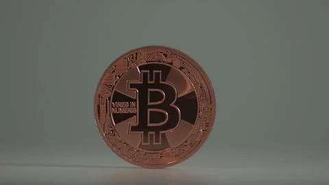 New digital decentralizes currency Bitcoin BTC rotate on the table with white Stock Footage 129879655