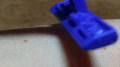 The new disposable safe plastic machine in blue color shaves off the fine hairs Stock Footage 149218746