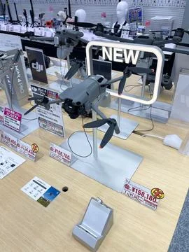 New DJI drones on display in electronics store Stock Photos