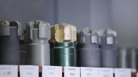 New Drill Bits on shelving in stock. Oil drilling equipment for drilling rig Video stock 153512353