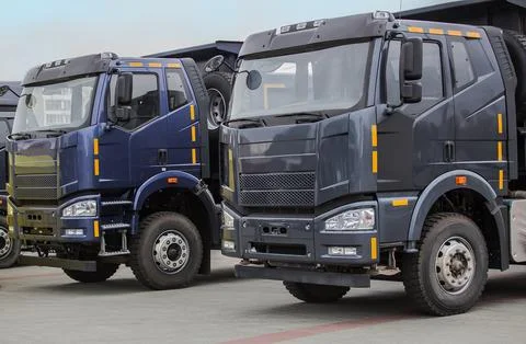 New dump trucks in a row Stock Photos