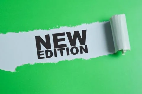 New edition text written in torn paper. For product launch, publishing Stock Photos