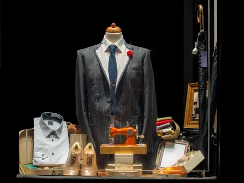 New elegant jacket stitching in tailor's showcase Stock Photos