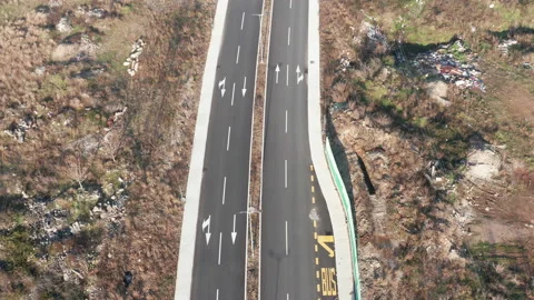 New empty four-lane road in desolate rural countryside clear, surface marking Stock Footage 145483186