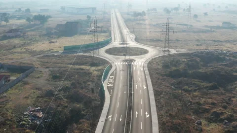 New empty four-lane road in desolate rural countryside, clear surface marking Stock Footage 145500798
