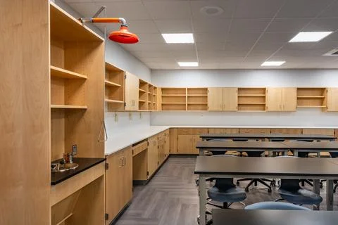 New empty nondescript US High School science classroom with eye wash Stock Photos