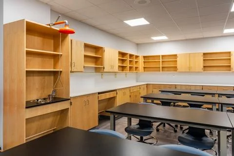 New empty nondescript US High School science classroom with eye wash Stock Photos
