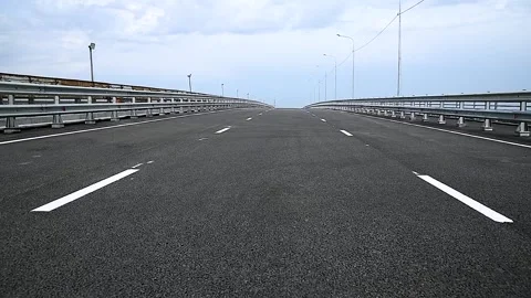 New empty paved road over a bridge over railway tracks Stock Footage 273197655
