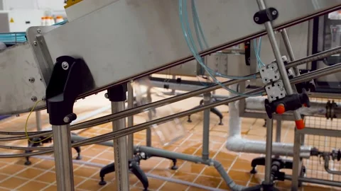 New empty plastic bottles move on the conveyor belt. Stock Footage 136072156