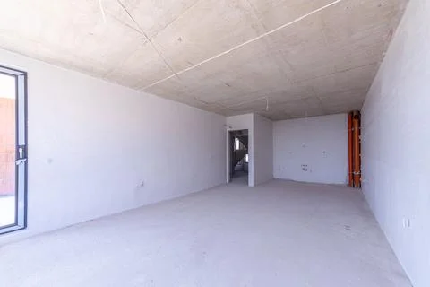 New empty room under construction. Plaster walls. New home. Concrete walls... Stock-Fotos
