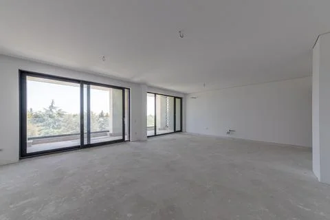 New empty room under construction. Plaster walls. New home. Concrete walls... Stock-Fotos