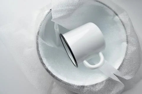 New enamelware on a white background Stock Photos