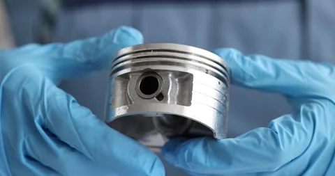 New engine piston in hands of auto mechanic closeup 動画素材 169155565