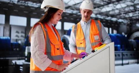 New Engineer Worker Learning Power Plant Machines With Mentorship Team Stock Photos