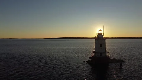 New England Lighthouse with the Sun as its Light Stock Footage 275268331