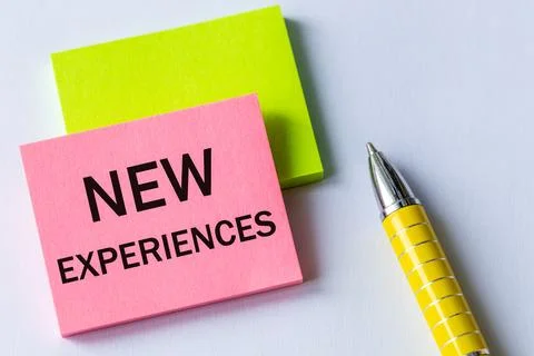 New experiences, Note on colored paper, motivational text, Concept, Persona.. Stock Photos