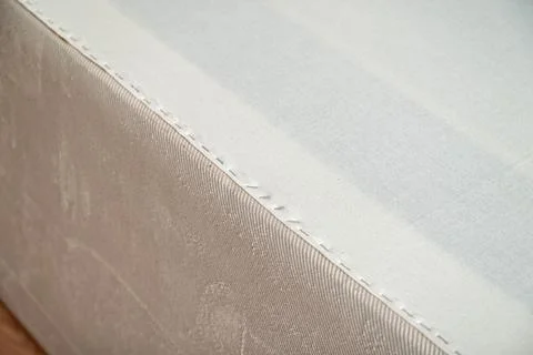 New fabric applied with staples to replace the worn out fusible interlining.. 스톡 사진