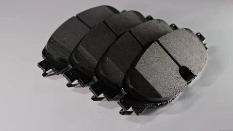 New four disc brake ceramic pads, close up. Set of spare parts for car brake Stock Footage 240091877