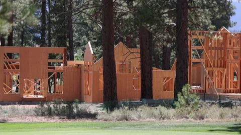 New Framed Homes Under Construction in Wood - Shallow Depth of Field Stock Footage 158146608