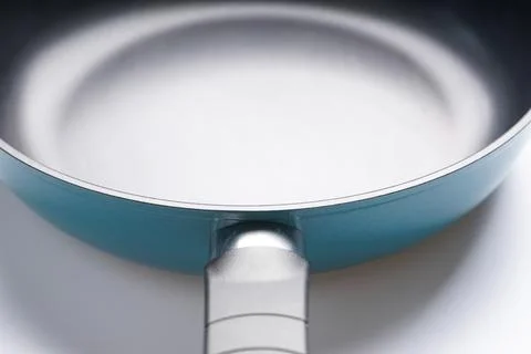New frying pan on white background, Close-up. Stock Photos