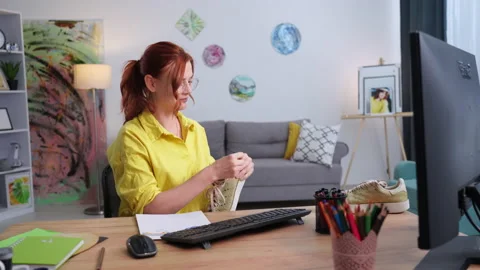 New generation creativity, a young female designer draws patterns on sneakers Stock Footage 206114209