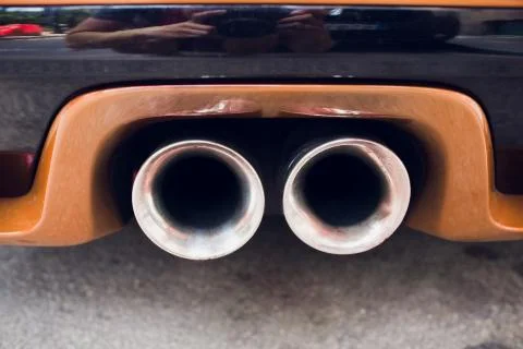 New generation of sportive mufflers. Rectangular Car Exhaust Tail orange. Foto stock