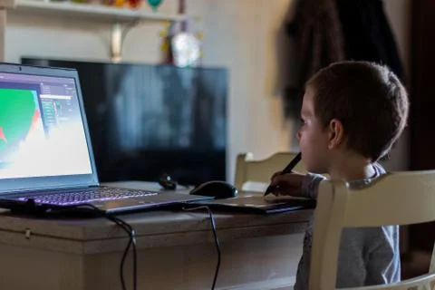 New generations: child learns to draw using a tablet Stock Photos