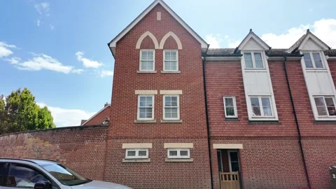New Gothic Arched Brick Homes on a Major Thoroughfare Stock Footage 338361658