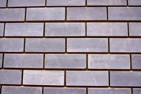 New gray brick wall. texture, pattern. close-up. Stock Photos