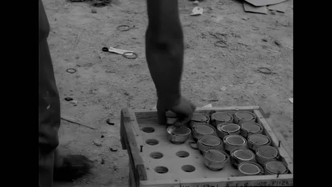 NEW GUINEA - 1944 - US troops load 4.5" rockets on a mechanized landing craft Video stock 312793604