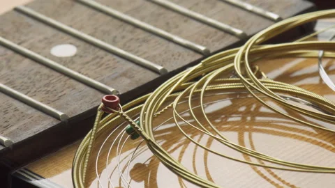 New guitar strings are ready to wind. Macro shot Stock Footage 321527377