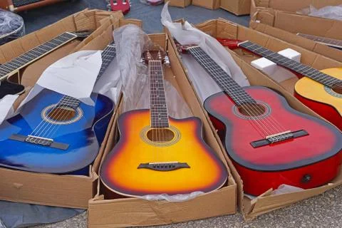 New guitars in boxes Stock Photos