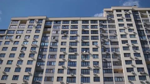 A new high multi-storey modern residential building against the blue sky. Stock Footage 163741386
