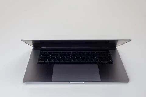 New high-speed thin grey aluminum laptop computer notebook front view Stock Photos