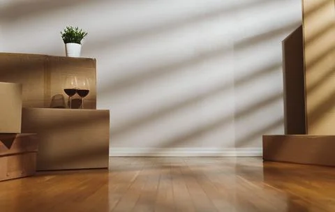 New home concept. Boxes in empty room. Stock Photos