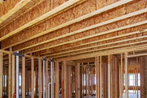 A new home under construction interior and plumbing inside a house frame. Stock-Fotos