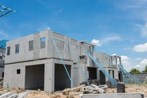New home under construction using steel frames against cloudy sky Stock Photos
