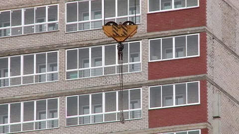 New hook of a construction crane sways in the wind Stock Footage 74987059