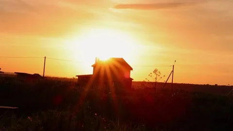 New house in the rays of the sun, selective focus on the grass. Stock Footage 154611241