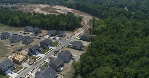 New housing development, clearing made for additional structures drone aerial 4k Stock Footage 114139915