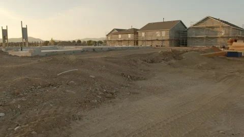 New Housing Development Construction with Dirt Lot and Foundations - Tilt -  Stock Footage 139503266