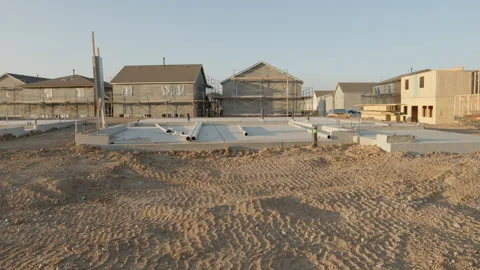 New Housing Development with Homes Under Construction - Tilt Up Stock Footage 139503013