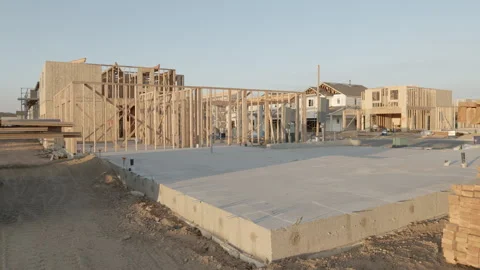 New Housing Development with Homes Under Construction and Foundation in Fore Stock Footage 139503065