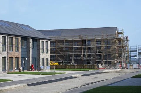 New housing development in progress building houses for increased demand for Stock Photos