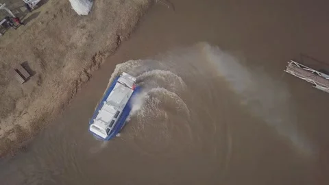 New hovercraft sails maneuvering on shallow river water Stock Footage 155286570